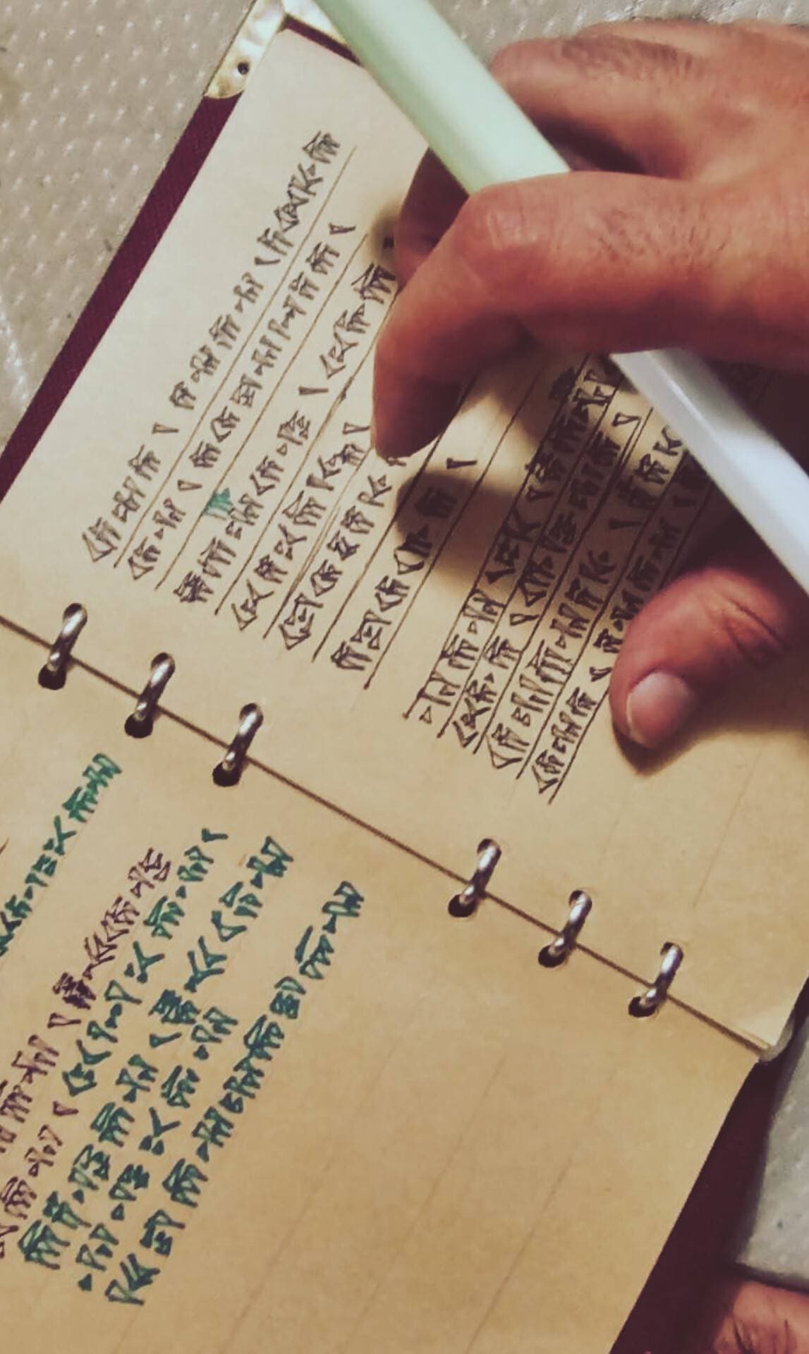 Cuneiform handwritten in a notebook